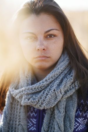 Worried woman outdoors looking at camera