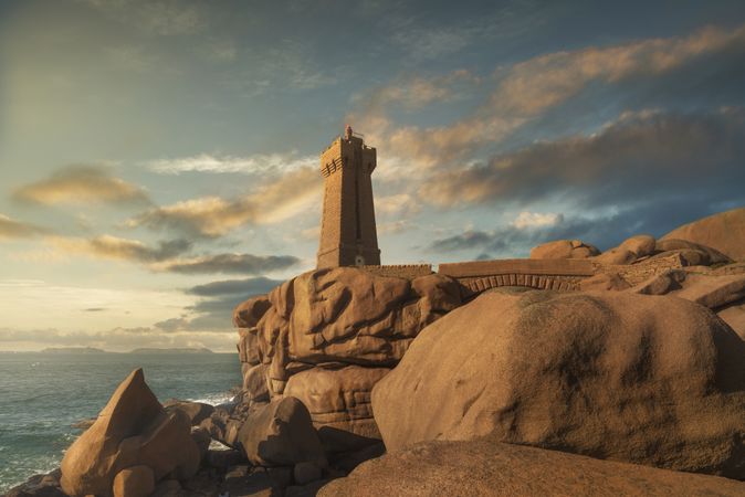 Ploumanach lighthouse sunset in pink granite coast, Brittany, France