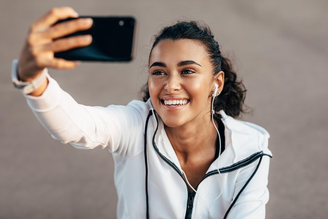 Woman taking a selfie while working out