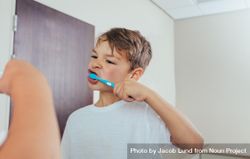 Little  boy brushing teeth in bathroom 4ZJKr4