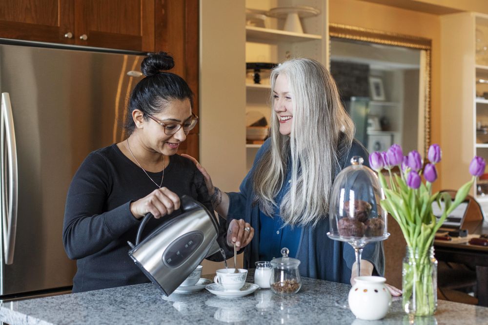 Woman pouring hot water for tea
