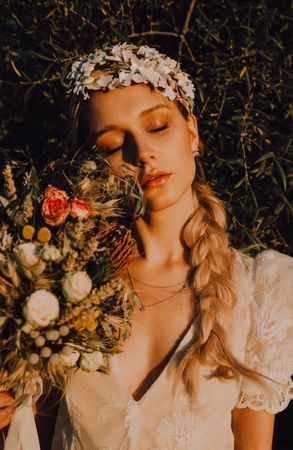 Woman in dress with flower bouquet