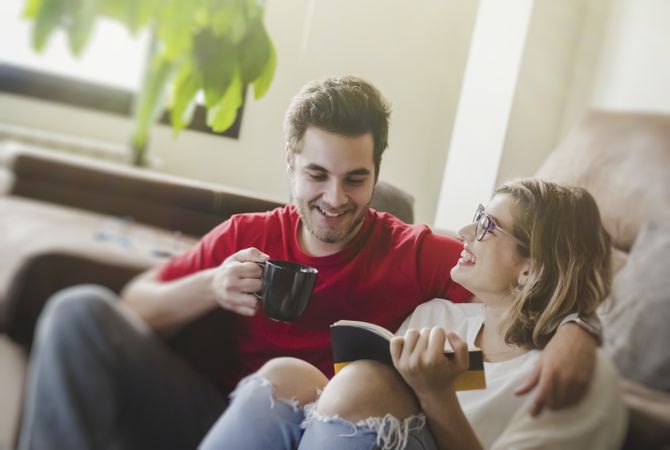 Couple sitting at couch together