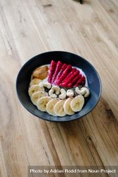 Fresh breakfast bowl with fruit, nuts and yogurt 0Jmzlb
