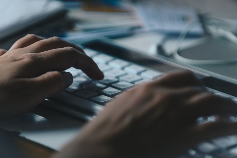 Person using computer keyboard