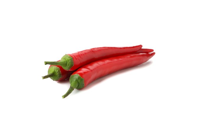 Tasty red chilli peppers isolated on blank background