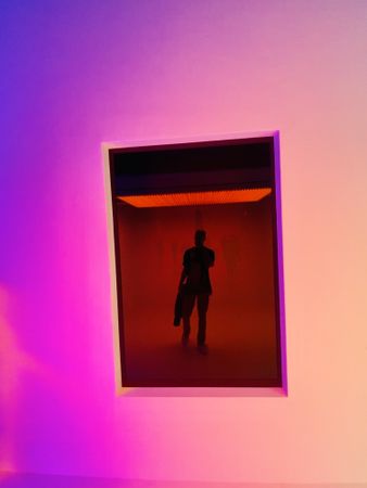 Silhouette of man in a room giving the illusion of person inside frame