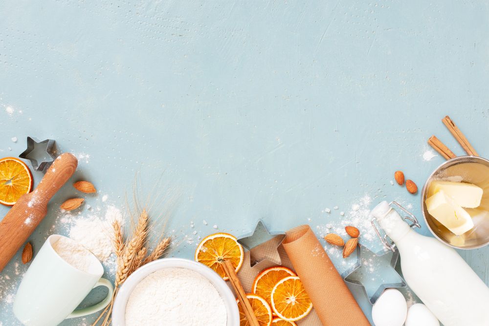 Blue background with raw ingredients for baking