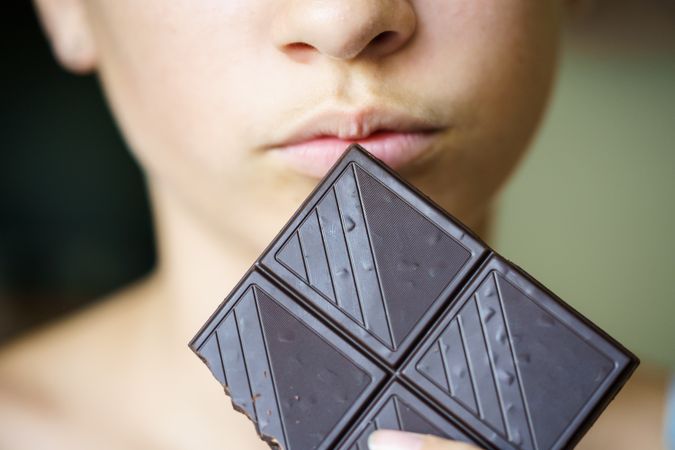 Cropped shot of girl with dark chocolate