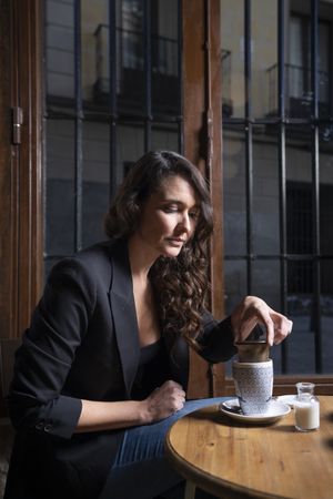 Young female with tea cup in cafe