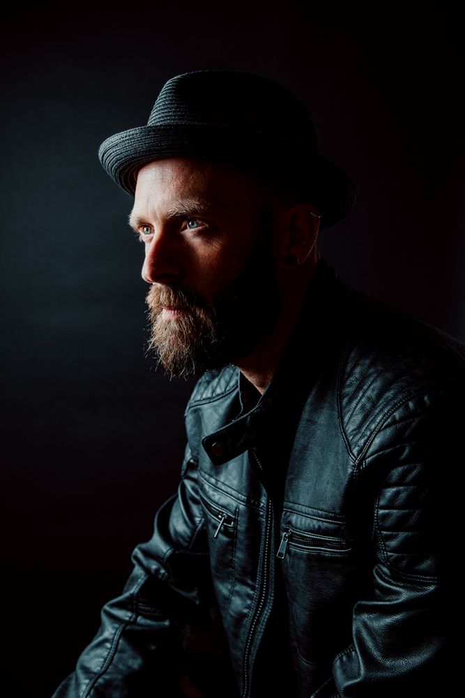 Young bearded guy in leather jacket