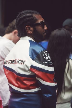London, England, United Kingdom - September 18 2021: Black man in biker jacket at Fashion Week