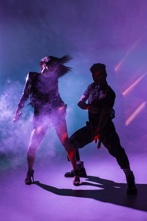 young dancers near smoke