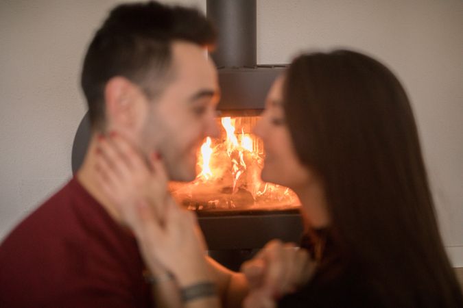 Couple sitting near fireplace