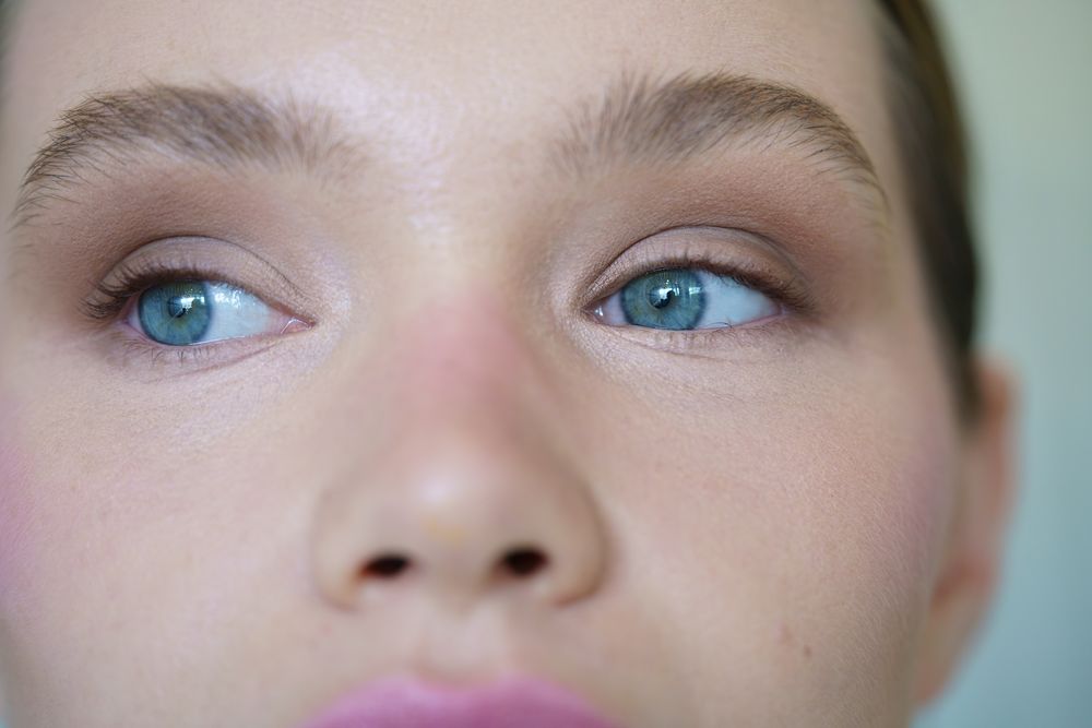 Close-up of a woman with blue eyes