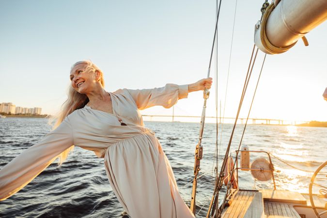 Beautiful older woman with long hair on a boat