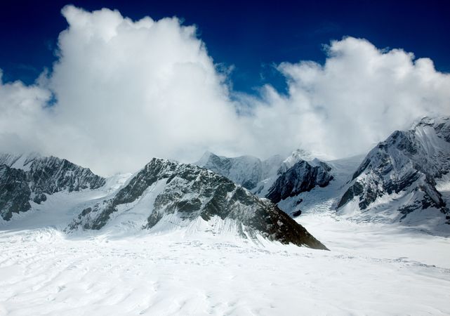 Clouds sweeping over snowy peaks of Mount McKinley in Alaska