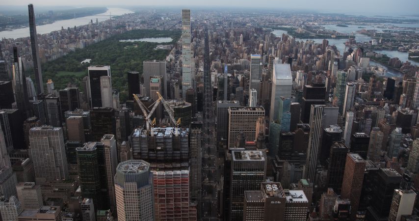 Urban Sunset Scenery with Midtown Manhattan. Historic and Modern New York City Skyscrapers, New Building Under Construction. Aerial View of a Popular American Travel and Business Destination