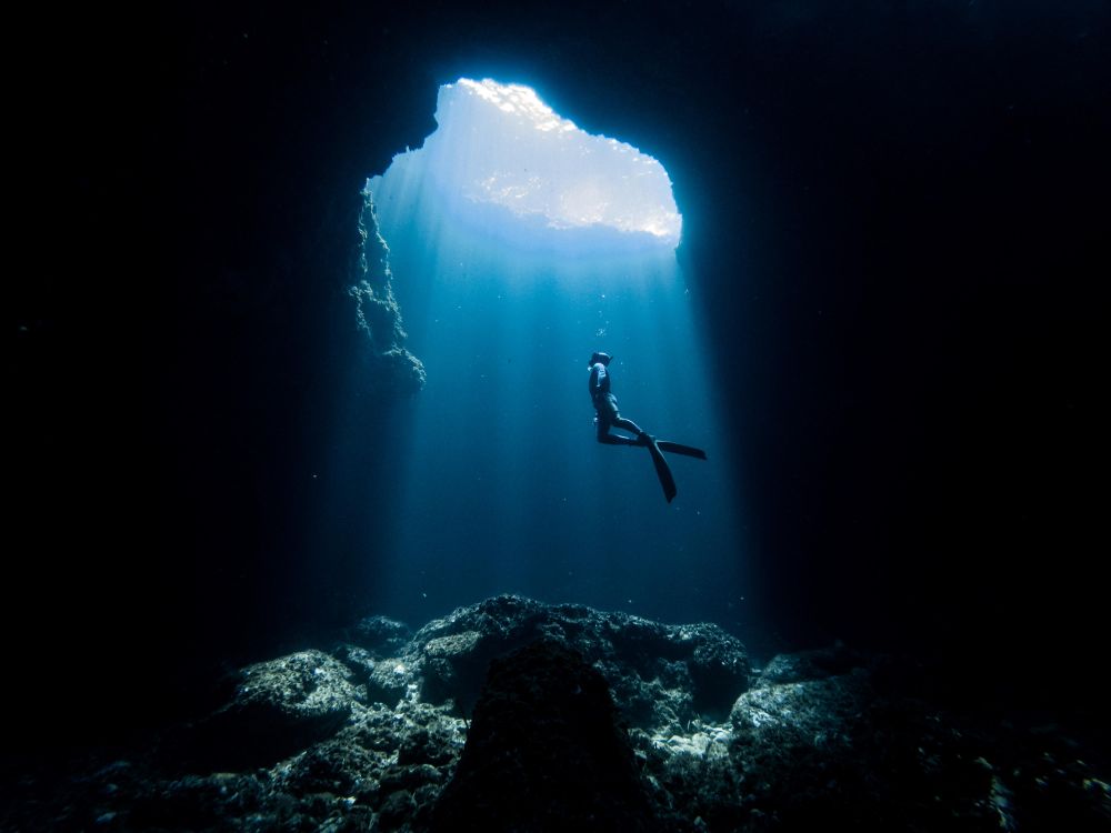 Person swimming to the surface