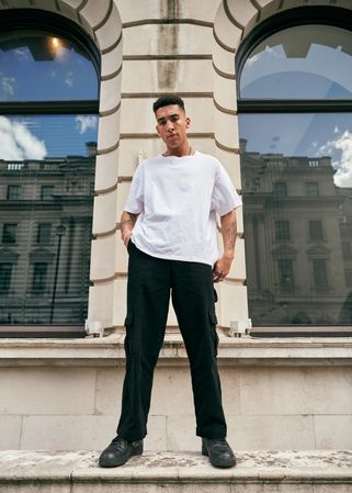 Stylish young man standing outside in London