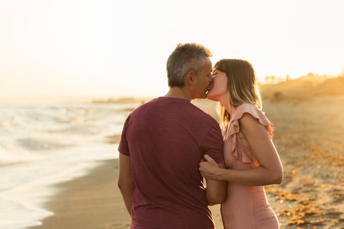 Adult couple embracing near sea