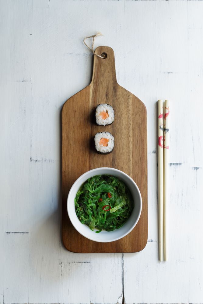 Sushi and seaweed served on desk