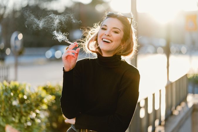 woman smoking on street