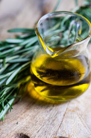 Olive oil and fresh rosemary, close up