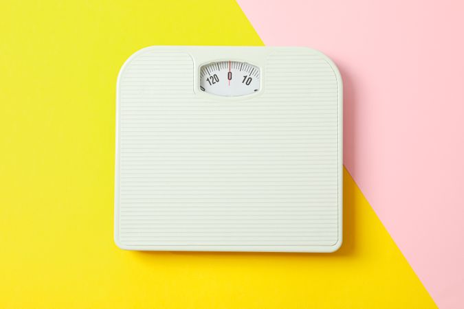 weigh scales on two tone background, space for text