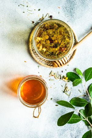 Top view of floral tea with honey