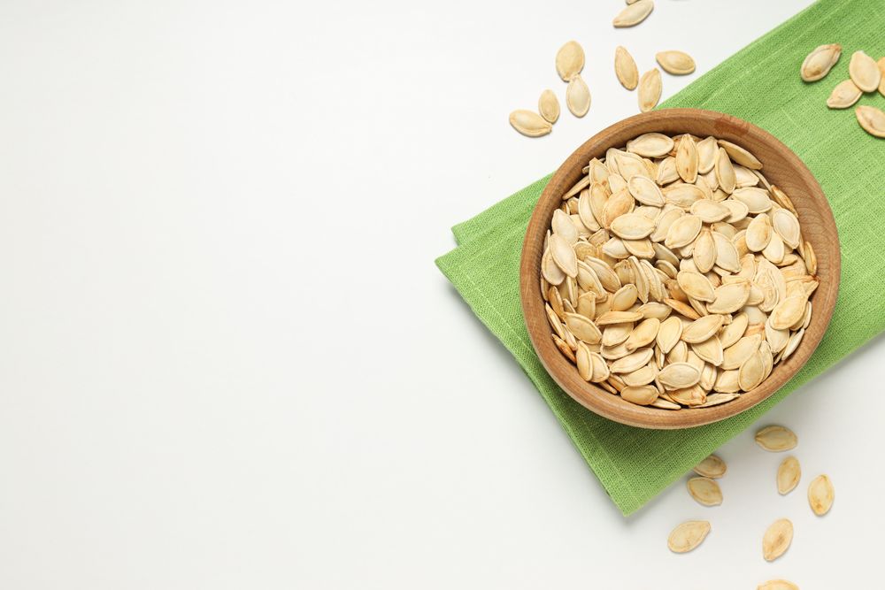 Cooking ingredients for fall season - pumpkin seeds, pumpkin
