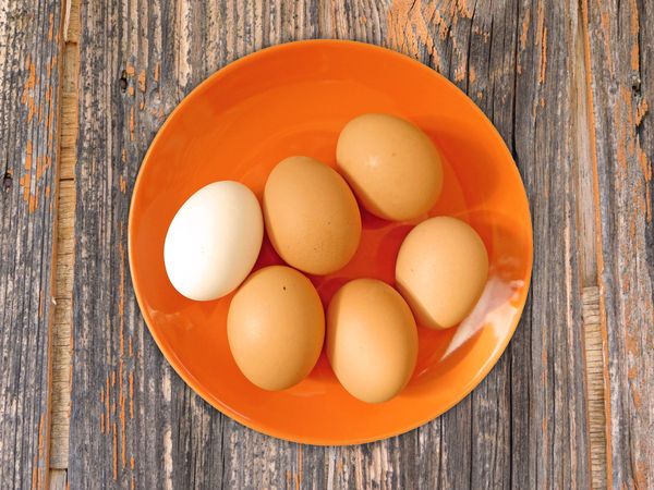 Eggs On The Wooden Background