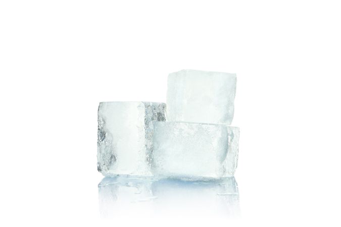 Three clear ice cubes on blank background