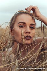 Portrait of young woman in brown wheat field 4A8zm5
