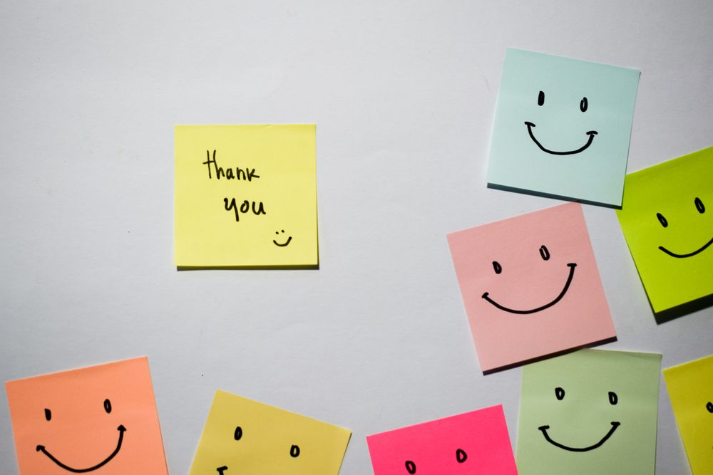 Thank you and smile emoticon on sticky notes