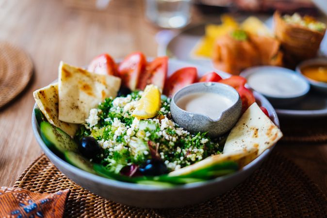 Tabbouleh plate with pita and vegetables