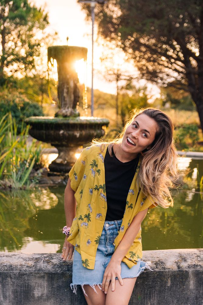 Joyful female relaxing in park