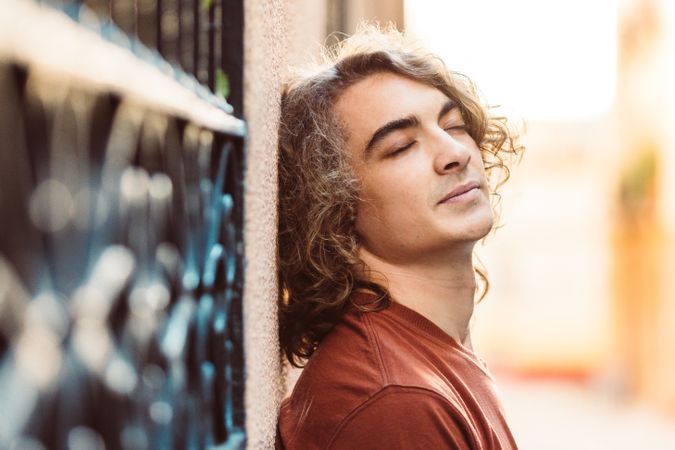Positive handsome man on street