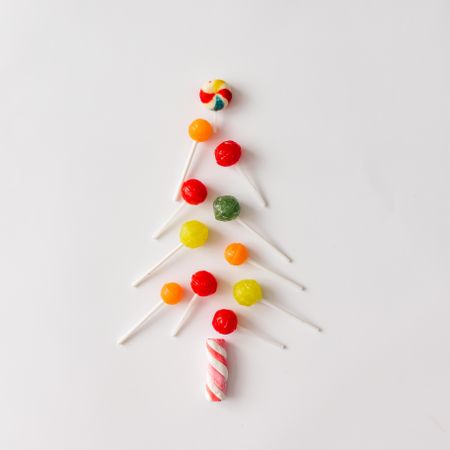 Christmas tree made of marshmallow candy and colorful lollipops