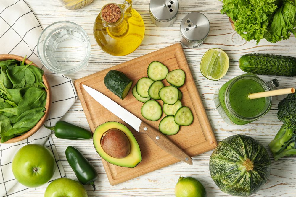 Concept of cooking salad on wooden table