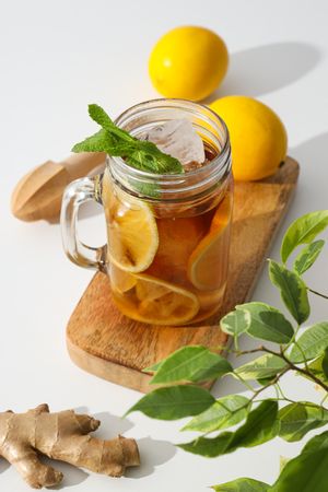 A glass of cold tea with fresh orange slices