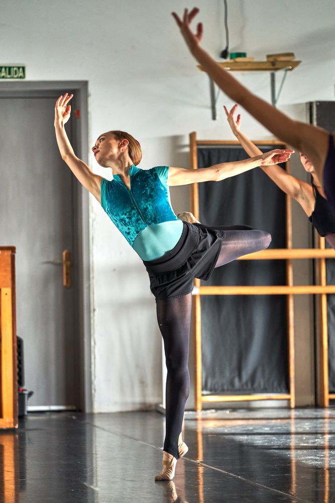 Ballet dancer warming up and dancing at a dance academy