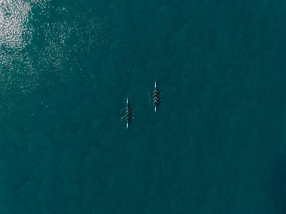 Aerial photo of two teams racing against each other.