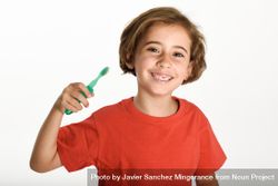 Smiling child brushing her teeth 47v3B5