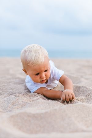 Blond baby on the beach