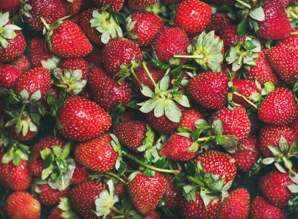 Freshly washed batch of strawberries, horizontal composition