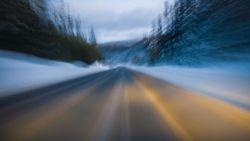 Road leading to wonderful mountains in snow