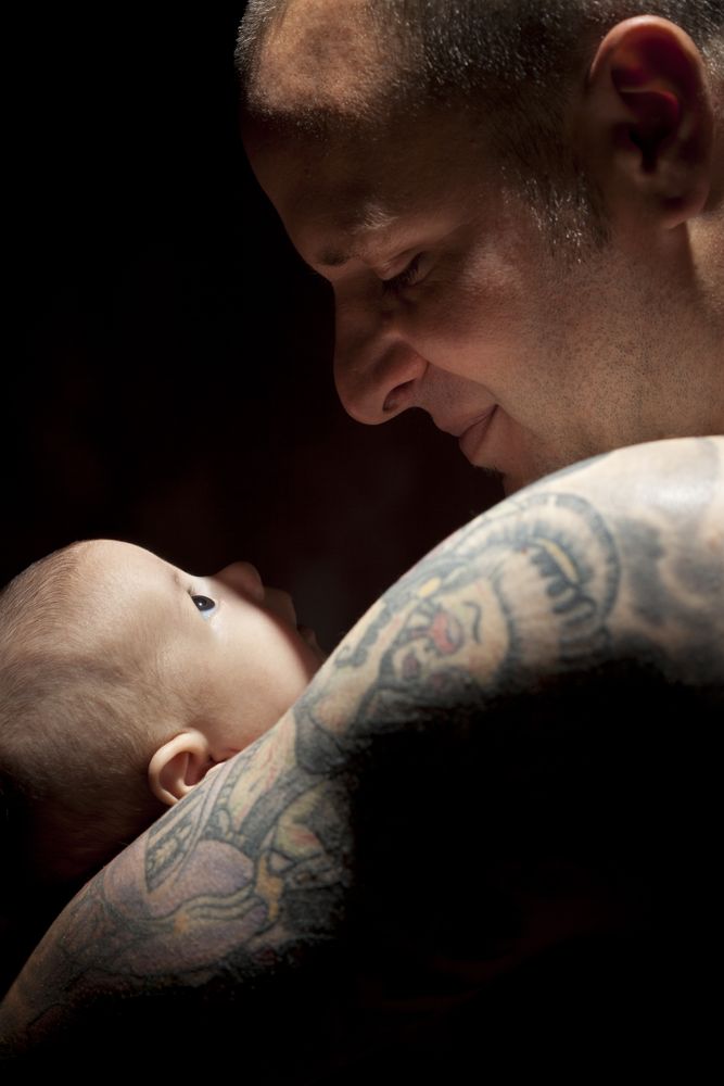 Young Father Holding His Newborn Baby