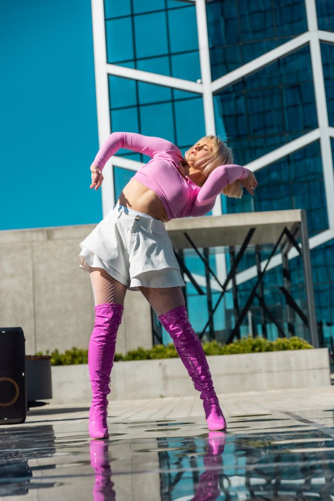 Woman Vogue Dancer Practicing Her Choreography In Urban Environment During The Day.