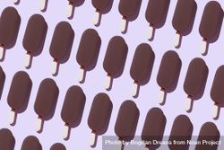 Chocolate popsicles on lavender background 5XZYMb